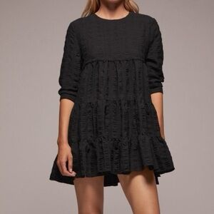 black Zara voluminous tiered mini dress.